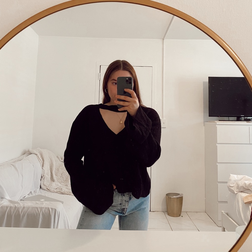 Black sweater with cutout and bell sleeves